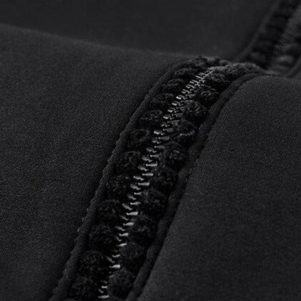 Detail of black sherpa-lined hoodie with zipper from men's winter tracksuit.