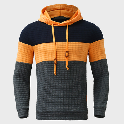 Buzo Melbourne con capucha para hombre, diseño en bloques de color, estilo casual y cómodo, ideal para días frescos.
