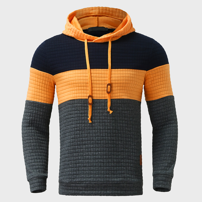 Buzo Melbourne con capucha para hombre, diseño en bloques de color, estilo casual y cómodo, ideal para días frescos.