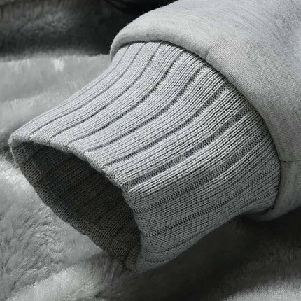 Close-up of Frost Peak men's fleece jacket cuff, showcasing ribbed texture and plush interior lining, ideal for winter warmth.