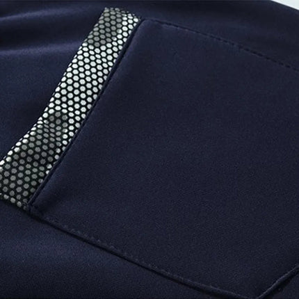 Close-up of Conjunto Polar Frost Peak men's navy pants with reflective pocket detail.