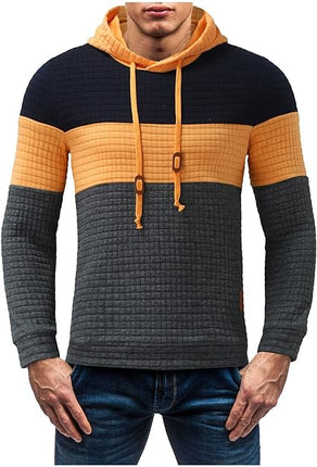 Buzo Melbourne con Capucha para Hombre en diseño casual, bloques de color negro, naranja y gris, ideal para otoño y looks urbanos.