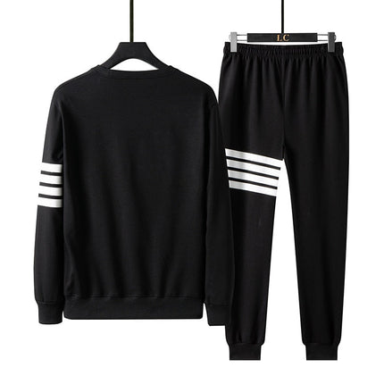 Conjunto de buzo y pantalón Drupin para hombre en negro, moderno y cómodo, ideal para uso informal, con diseño de rayas en las mangas y piernas.