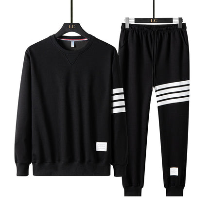 Conjunto de buzo y pantalón Drupin para hombre en negro con detalles blancos, ideal para estilo casual y confort diario.