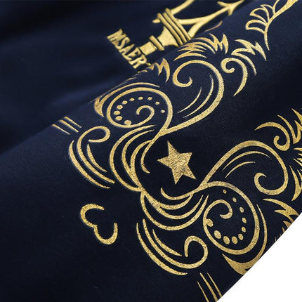 Detailed close-up of the gold embroidered design on the Arctic Flex hoodie, capturing elegant swirls and star motifs for a luxurious look.