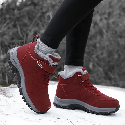 Red waterproof snow boots with anti-slip soles, perfect for keeping feet warm in cold conditions. Stylish and functional winter footwear.