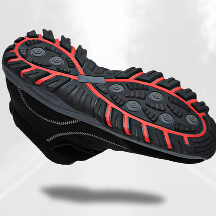 Durable black winter women's boot with red tread soles for enhanced grip and warmth, perfect for icy conditions.