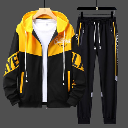 Conjunto deportivo urbano para hombre en negro y amarillo, con capucha y cierre frontal, ideal para entrenamiento o uso diario.