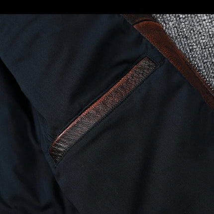 Close-up of 100% cowhide leather jacket featuring a pocket detail and textured fabric, showcasing premium craftsmanship.