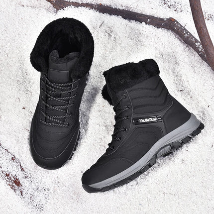 Warm men's hiking boots on a snowy surface, perfect for outdoor adventures and cold weather exploration.