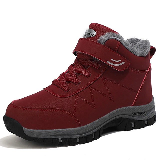 Red waterproof snow boots with warm lining and non-slip sole, ideal for outdoor winter activities.
