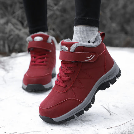 Red waterproof snow boots with non-slip soles and warm lining, perfect for winter conditions.