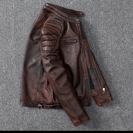 Men's 100% cowhide leather jacket, dark brown with zippered pockets and textured design, laid flat on a grey surface.