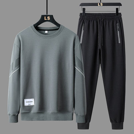 Conjunto Trucker para Hombre en gris, buzo sin capucha y pantalón jogger negro, estilo urbano minimalista, moda masculina casual.
