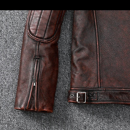 Close-up of a 100% cowhide leather jacket sleeve showcasing zipper detail and rich texture.