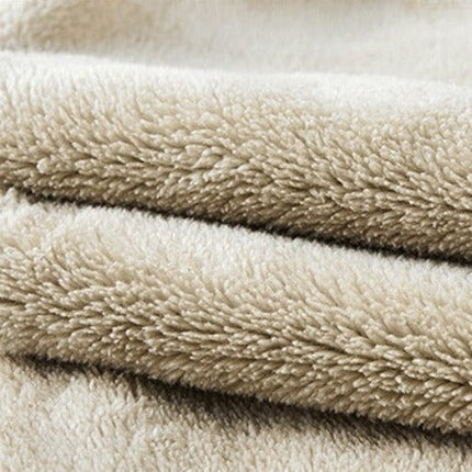 Close-up of soft beige sherpa fabric used in men's hooded sweatshirt and pants set.