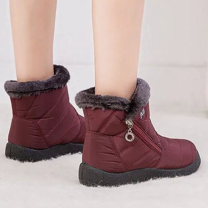 Botas de mujer impermeables con abrigo de felpa, color burdeos, diseño chic y moderno, ideales para invierno.