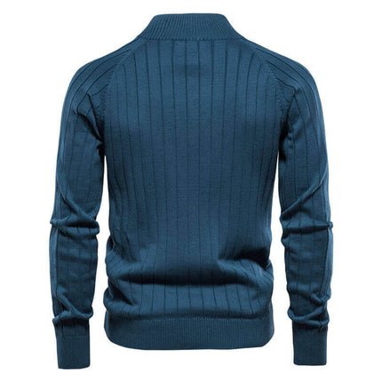 Campera Hombre de punto fino, azul con patrón geométrico, terminaciones acanaladas y cierre metálico. Ideal para un look moderno.
