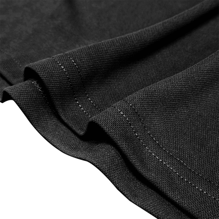 Detalle de tejido de algodón peinado negro de Chomba Hudson Gingham, perfecto para chombas hombre elegantes y relajadas.