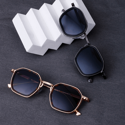 Gafas de sol hombre Alain Delon, diseño minimalista y anguloso, montura metálica delgada, lentes oscuras UV400. Estilo clásico.