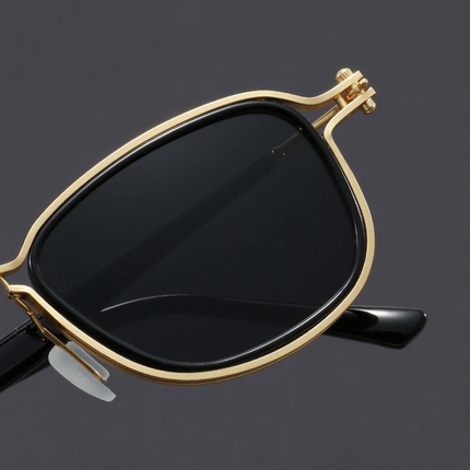 Gafas de sol Kravitz Square con armazón metálico dorado y lentes oscuros, diseño retro-moderno. Ideal para hombre. Protección UV400.
