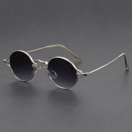 Gafas de sol redondas Cobain con armazón metálico, estilo clásico con tinte sutil y diseño audaz, ideales para hombre.