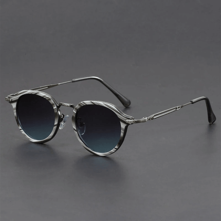 Gafas de sol retro Helios para hombre, con lentes redondos y detalle metálico, estilo vintage moderno, protección UV400.