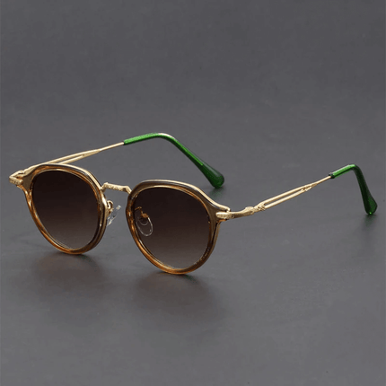 Gafas de sol Helios retro para hombre con lentes redondos, patillas metálicas esculpidas y estilo vintage. Protección UV400.