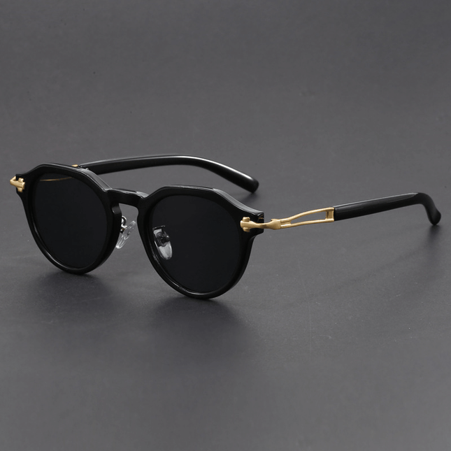 Gafas de sol vintage Dylan para hombre con protección UV400, estilo retro y moderno, lentes oscuros degradé y detalles metálicos.