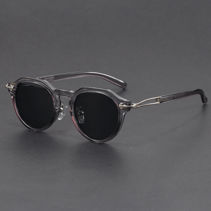 Gafas de sol vintage Dylan para hombre con protección UV400, diseño redondo geométrico y detalles metálicos en las patillas.