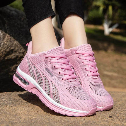 Pink breathable sneakers with ergonomic design offering optimal grip and support, perfect for daily activities.