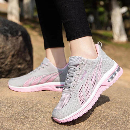 Nueva zapatilla deportiva transpirables en gris y rosa, ofrece comodidad ergonómica con suela antiimpacto y agarre óptimo.