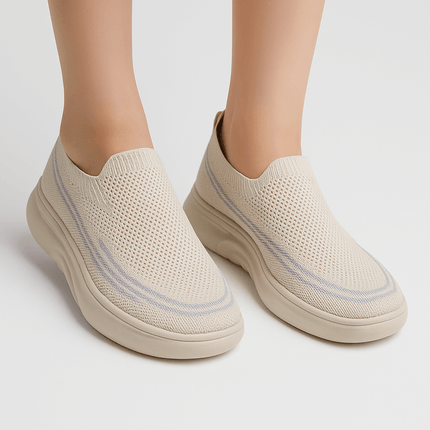 Beige slip-on sneakers with breathable fly-knit material for spring and autumn. Fashionable and comfortable design for small feet.