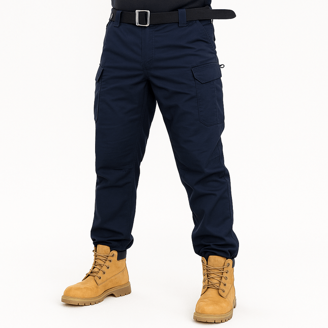 Men's tactical cargo pants in navy blue, showcasing durability and multiple pockets, perfect for urban and work environments.