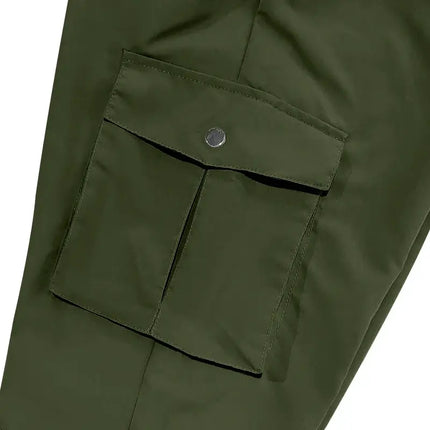 Close-up of versatile green sports pants with pocket detail, suitable for various waist sizes, emphasizing comfort and style.