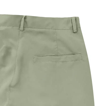 Versatile sports pants in green showing back pocket detail and belt loops for stylish and comfortable wear.
