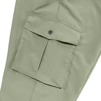Close-up of a green cargo pocket on versatile sports pants.