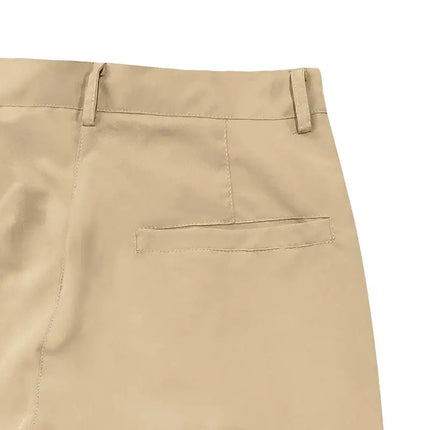 Close-up of beige versatile sports pants with back pocket and belt loops for men.