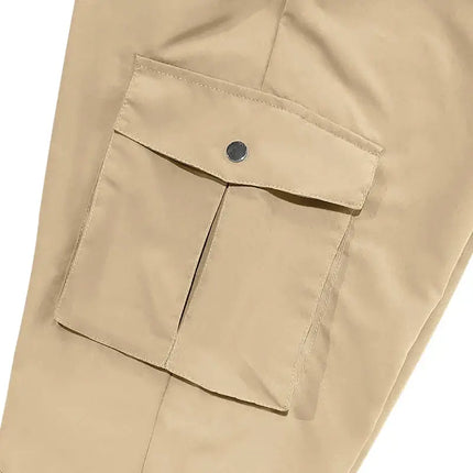 Close-up of beige versatile sports pants with pocket detail.