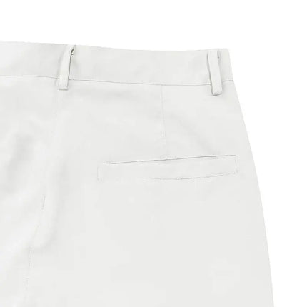 "Close-up view of versatile sports pants back pocket detail in light color"