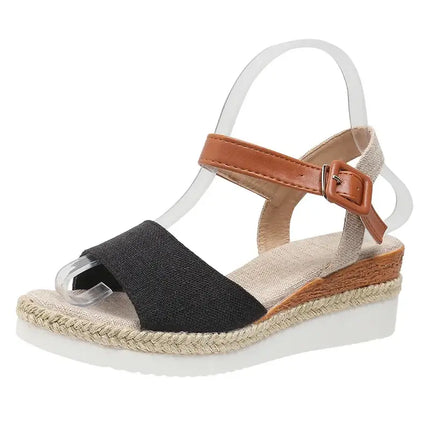 Elegant women's wedge sandal in black and brown, featuring a soft upper design ideal for summer events and stylish outings.