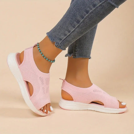 Pink Sandalia Verano Fit with open toe and adjustable back strap, perfect for summer style and comfort. Medium wedge heel and breathable design.