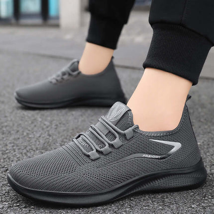 Zapatillas deportivas hombre urbanas, ligeras y cómodas para uso diario con suela de PVC y tela texturizada gris.