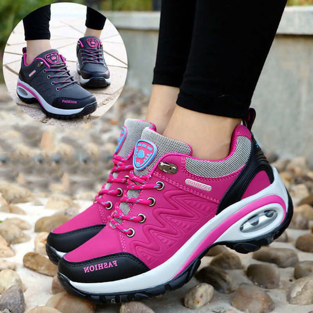 Pink and black Zapatillas ComfortWalk Outdoor with breathable leather, air cushion PU sole, and streamlined grip pattern for outdoor comfort.