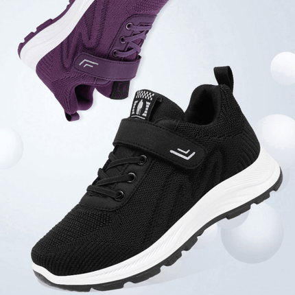 Zapatillas ComfyRun en negro y morado, con diseño moderno, tejido transpirable y suela de alto rebote, perfectas para cualquier actividad.