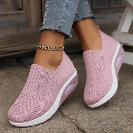 Women's pink slip-on sneakers with white soles, showcasing ComfortPlus design for ultimate comfort and stylish look with ankle bracelet.
