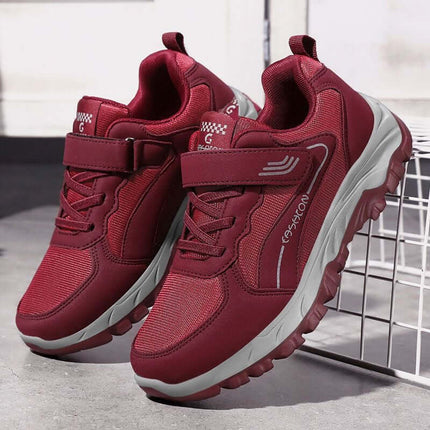 Red women's sports shoes, anti-slip, breathable mesh, stylish design for comfort and foot pain relief, perfect for active wear.