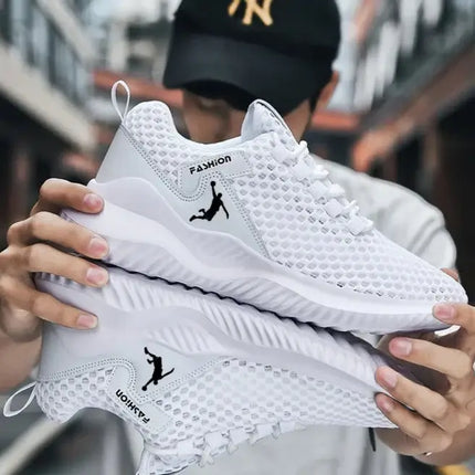 Zapatillas deportivas hombre ligeras y transpirables, ideales para correr. Diseño moderno en blanco.