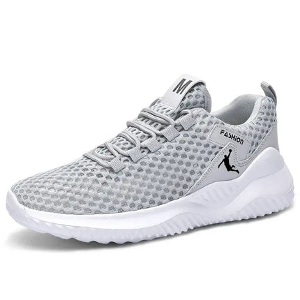 Zapatillas deportivas hombre grises, ligeras y transpirables para correr, estilo moderno para entrenamientos y actividades deportivas.