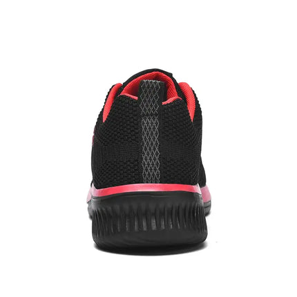 Vista trasera de las Zapatillas Hombre Raptor en negro y rojo, mostrando el diseño deportivo y agarre superior.